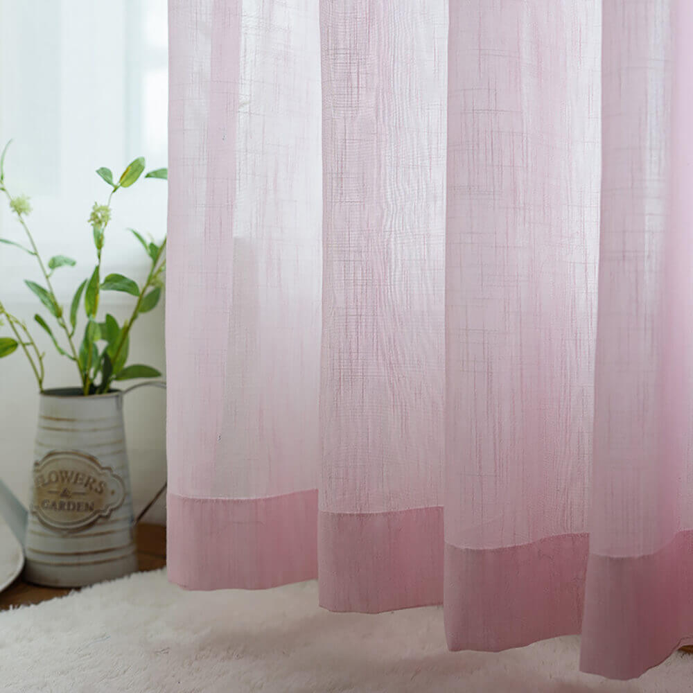 Light pink sheer curtains made of soft voile, perfect for airy living room windows